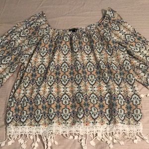 Exposed shoulder and arm (down to elbow)